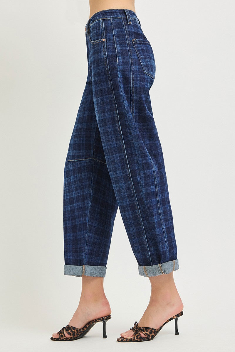 A model is shown from the waist down wearing blue plaid cropped jeans with rolled cuffs and leopard-print mule heels, set against a plain light gray studio background.