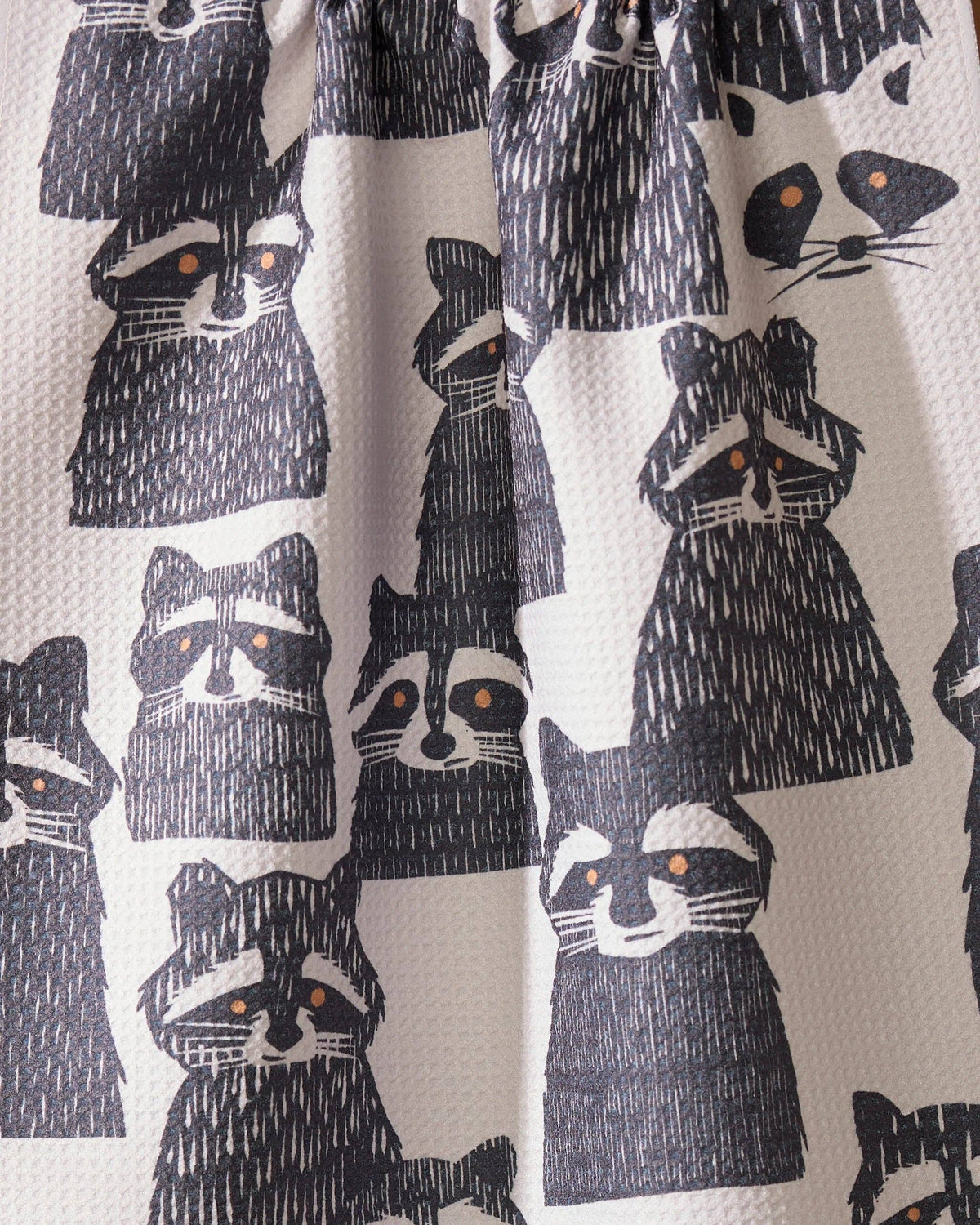 Pattern of raccoons on a fabric background