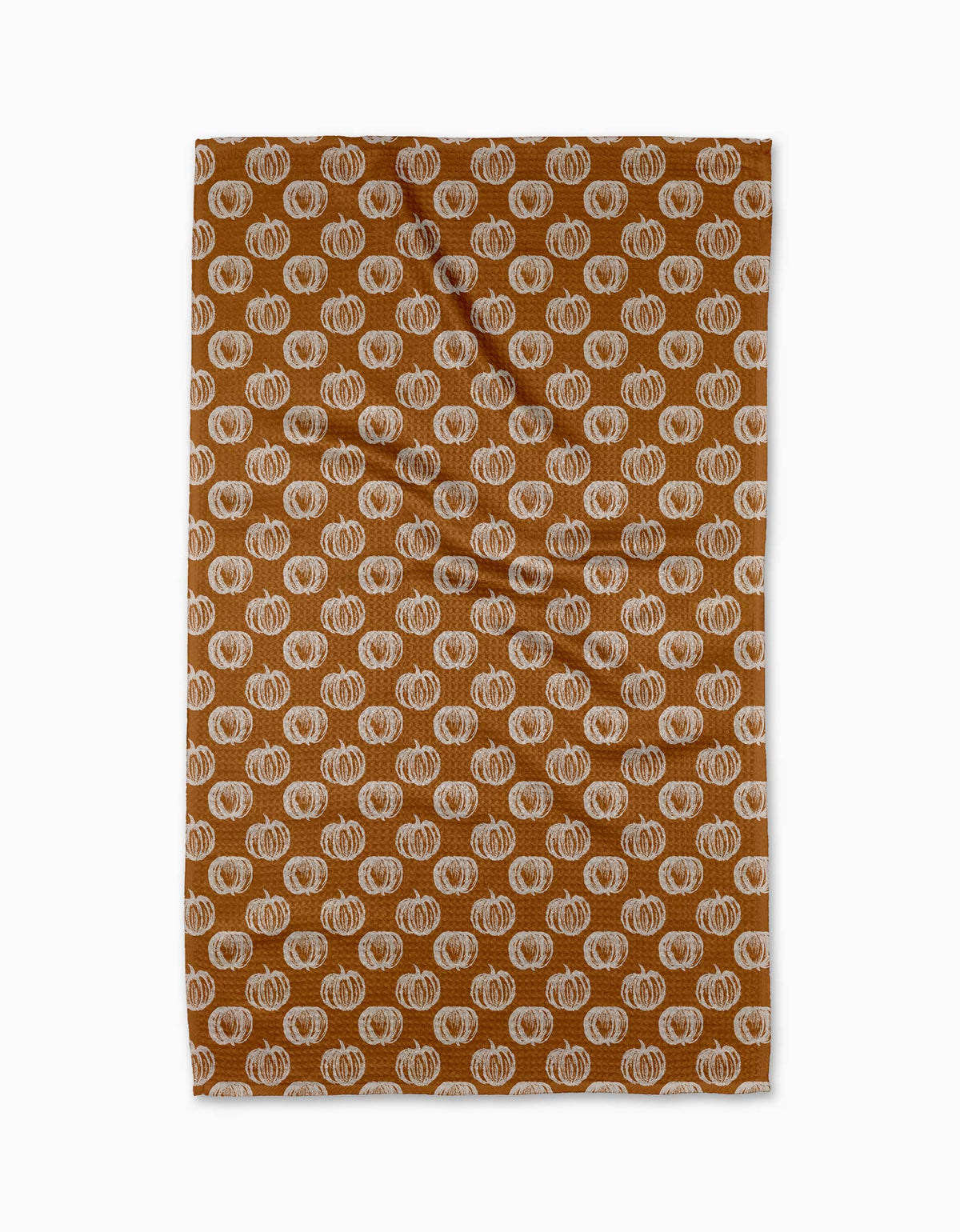 Patterned fabric with pumpkins on a brown background