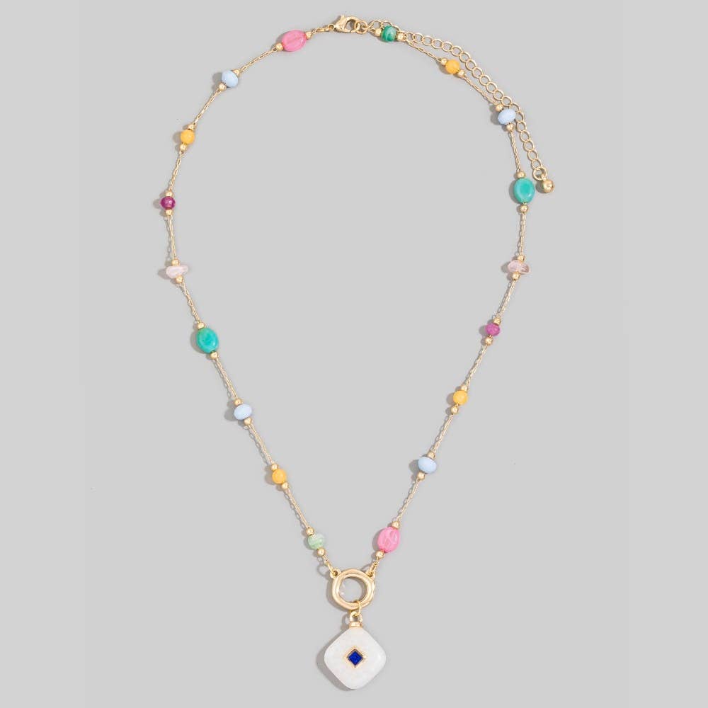 Necklace with colorful beads on a gray background